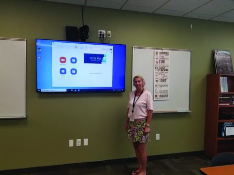 Mrs. Laura Priola stands next to new
technology in the classrooms.The
School installed a number of new features to make remote learning easier.