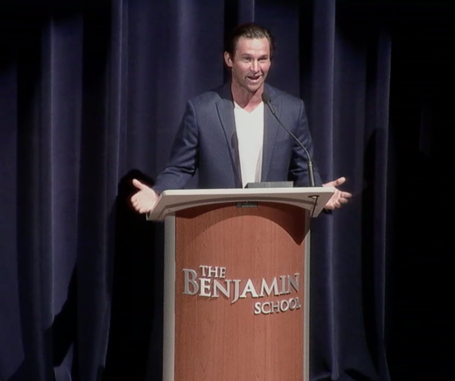 Alumnus of the year, Greg Norman,
Jr. ‘04 addresses a Zoom audience
of students, faculty, alumni, family,
and friends live from the stage of
Benjamin Hall.