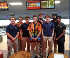 The boys’ and girls’ bowling teams pose for a team picture during one of their practices. Both teams look to be as successful as possible this year.
							