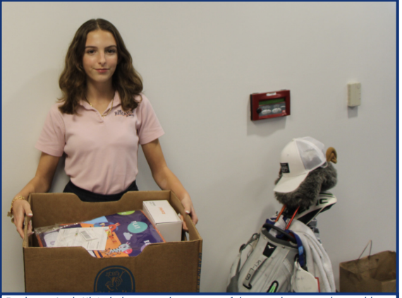Freshman Leah Klein helps to pack up some of the toys that were donated by Upper School Students to support the children of The Arc of Palm Beach County.