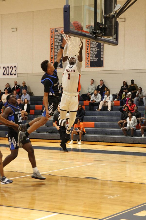 Junior Darell Sweeting goes for a dunk. Sweeting has been an integral part to the team’s success this year.