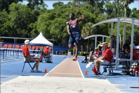 Junior Darrell Sweeting leaps in the long jump. Sweeting was one of the track team’s most important contributors this season.