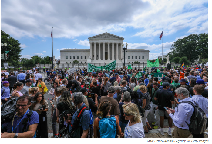 Crowds+gather+outside+the+Supreme+Court+building+in+Washington%2C+DC+in+protest+following+the+announcement+of+the+Dobbs+decision.+In+its+decision%2C+the+Court+seemed+to+overturn+precedents+set+by+Roe+v.+Wade.