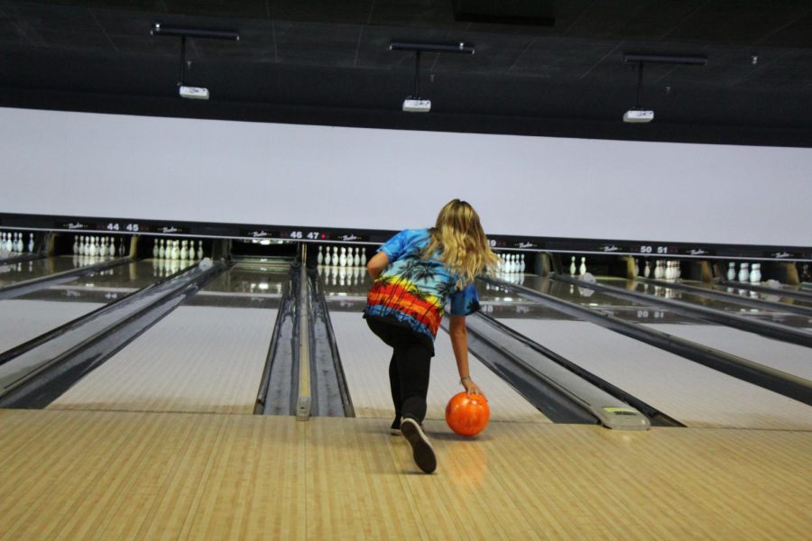 Junior Abby Spunar rolls the ball down the lane at Bowlero Jupiter. She was the top performer for the girls team in both games.