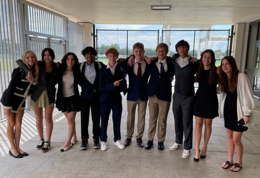Members of the US Speech and Debate team gather at the end of a long day of debating at Wellington Community High School on Saturday, Sept. 24.