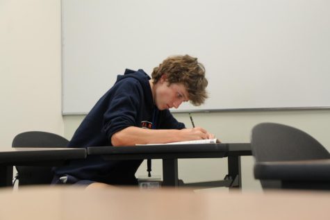 Freshman Reid Waxman takes the PSAT on Oct. 12. The freshman class took the exam in classrooms, while sophomores and juniors took it in the gym.