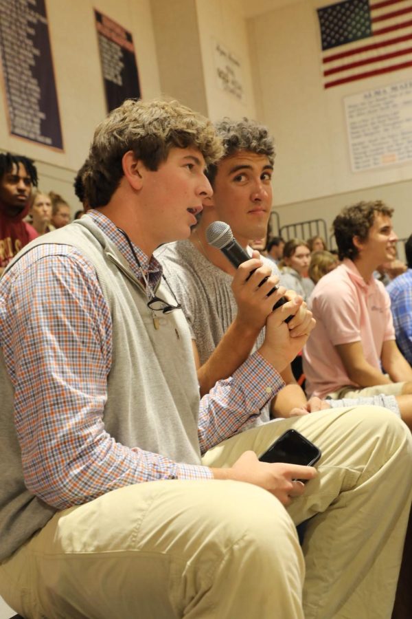 Jackson Brindise (left) and Carter Smith (right) broadcast the dodgeball match and speak to the crowd.