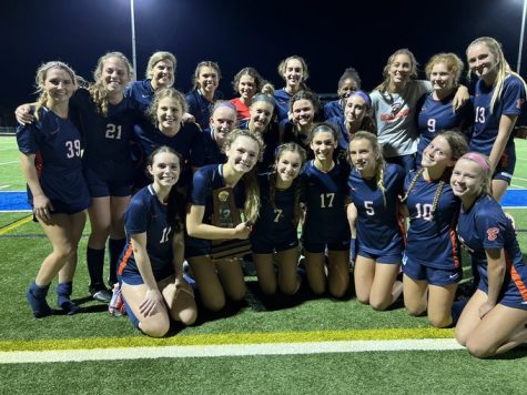 The girls soccer team celebrates on the field following their regional finals win over Edgewood on Tues. Feb. 14.