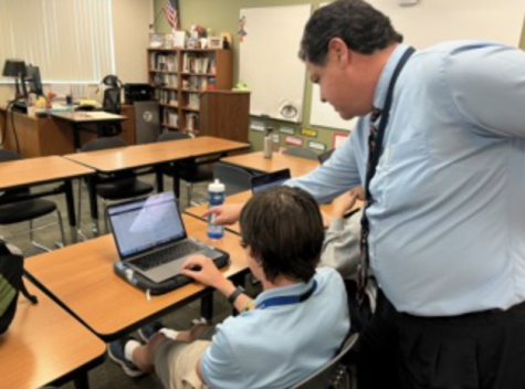 College Counselor Mr. Juan Alverez helps freshmen Landon Ferguson construct his schedule and get ready for the upcoming academic year. 


