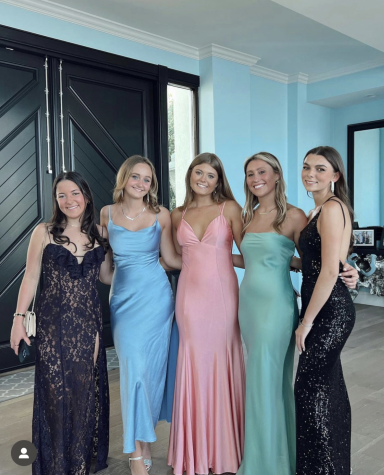 Senior Kate Grande, Juniors Kate Keller, Marleigh Nichols and Talia Miller all pose for a photo before prom.