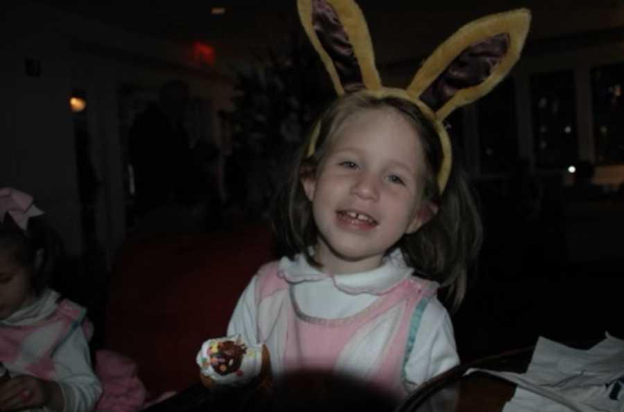Junior Ella Womble poses for a picture in her Easter Bunny ears. The Easter
Bunny is thought to bring candy to households as part of the celebration.