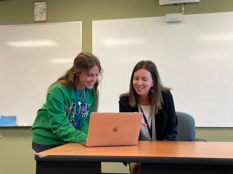 Mrs. Leshin is seen helping one of her students, Vanessa Zito, with an assignment.