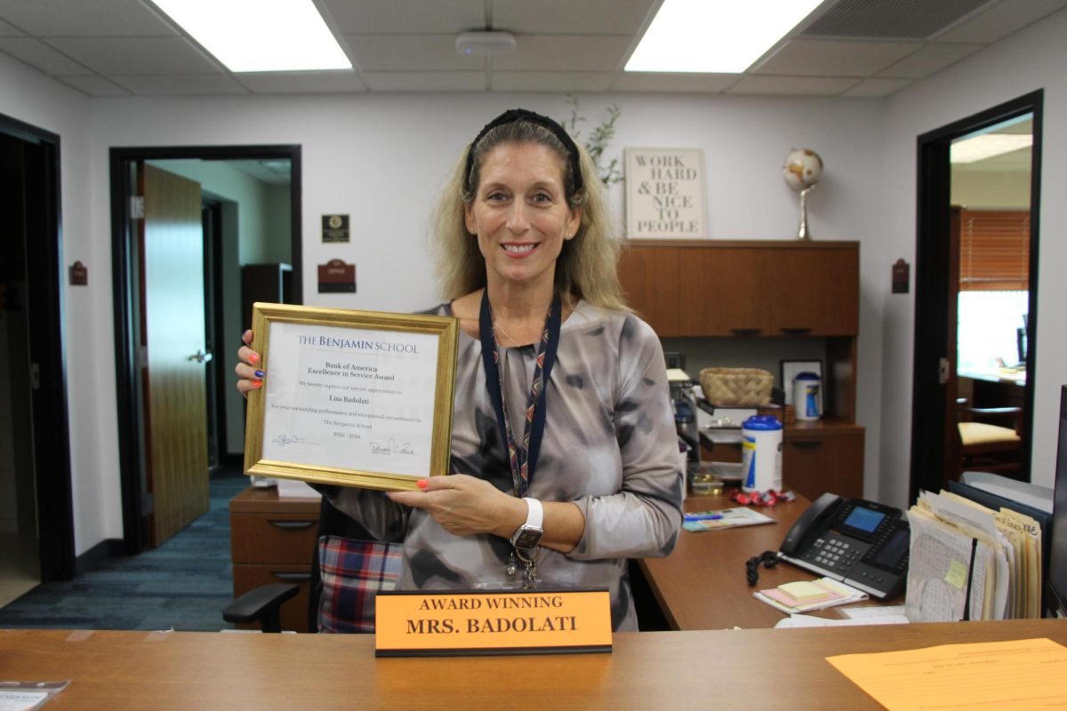 Mrs. Badolati, winner of the Excellence in Service Award, was given various plaques for her accomplishment. 
