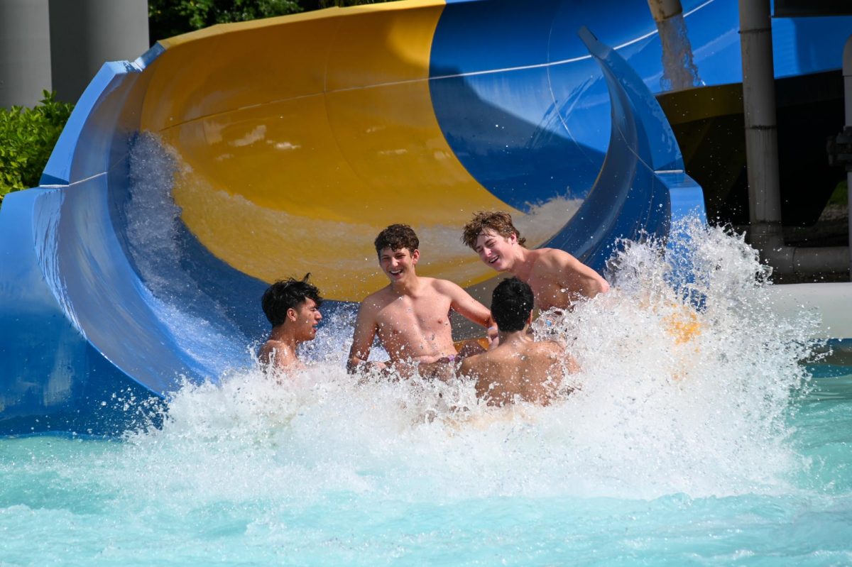 Seniors (from left to right) DJ Reyes, London Mielnik, Shaun Umar, and Johnny Cassidy emerge from the ride "Big Thunder."