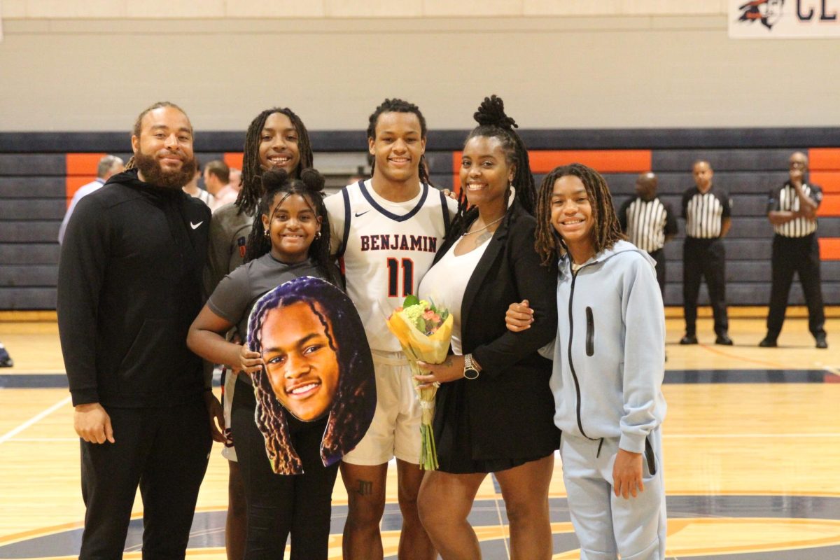 Senior Jacob Cosby-Mosley takes a picture with his family on his Senior Night. Cosby-Mosley is a multiple sport varsity athlete who is committed to play football at Wake Forest University.