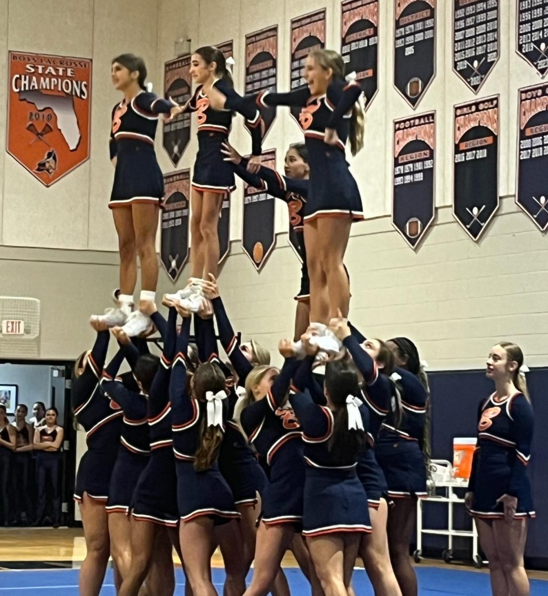 The Cheer team performs at the 8/30 Pep Rally for football team's big game against Miami Jesuit's Panthers. 