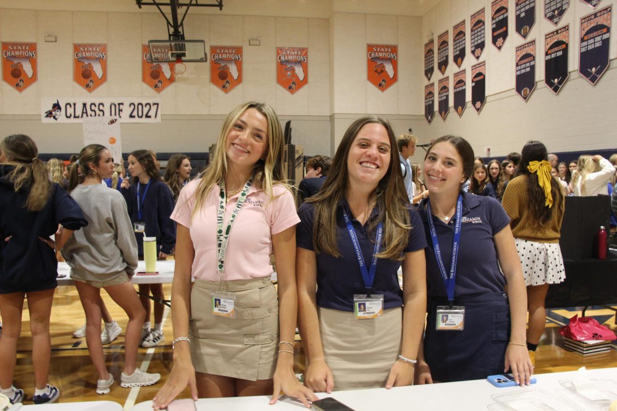 Juniors and Co-Presidents of The Kids
Luv Chemistry Club, Nickie Walsh,
Chase Zur, and Lila Cooper pose for a
photo next to their club stand during
the annual activity fair