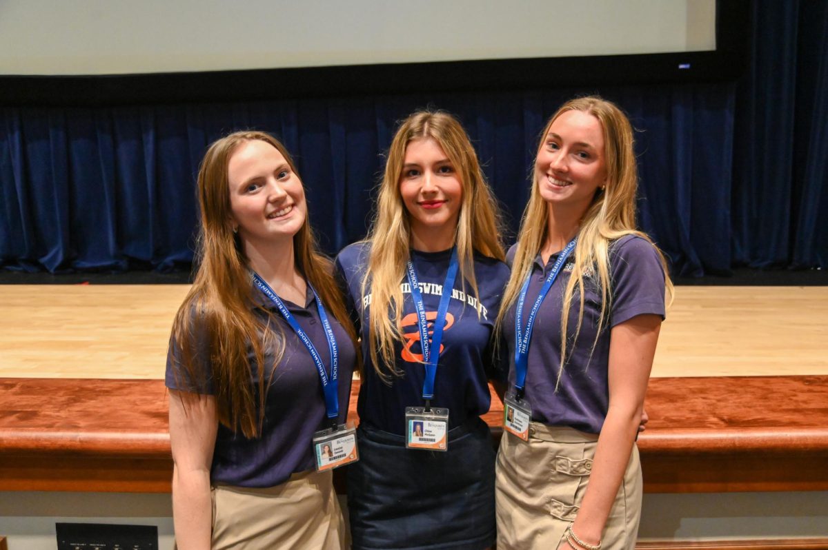 Seniors Lulu Swank, Chloe McGann, and Kate Quinlivan pose for a photo after giving their respective science presentations on the effects of Isoguvacine and Semaglutide to study epilepsy, Parkinson’s Disease Biology, and Energy Science and Nanotechnology. 