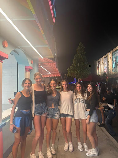 Juniors Kai Haydon, Sarah Napier, Emma Markin, Riley McCaughey, Marlee Schwab and Lila Brodner smile for a photo at Halloween Horror Nights before going on more rides and going through haunted houses.