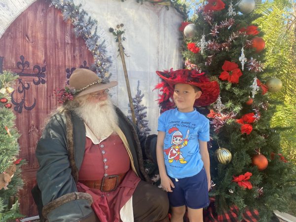 Hanul Wik greets a traditional Father Christmas figure in this holiday-themed
photograph.