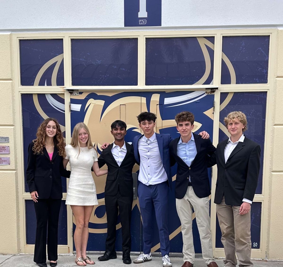 Sophomore Finley Strauss, and juniors London Allen, Dev Maharaj, Evan Sluiters, Owen Olbers and Sebastian Scaperotto pose for a photo at West Boca High School for the fifth Palm Beach Catholic Forensic League Tournament of the season. 