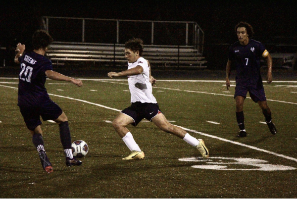 Sophomore Jake Froot dribbles around the attack line in the second half of the Bucs loss. “It was a tough one, for sure. We didn’t execute what we needed to do and now we look to see what we can do better for next year,” Froot answered. 
