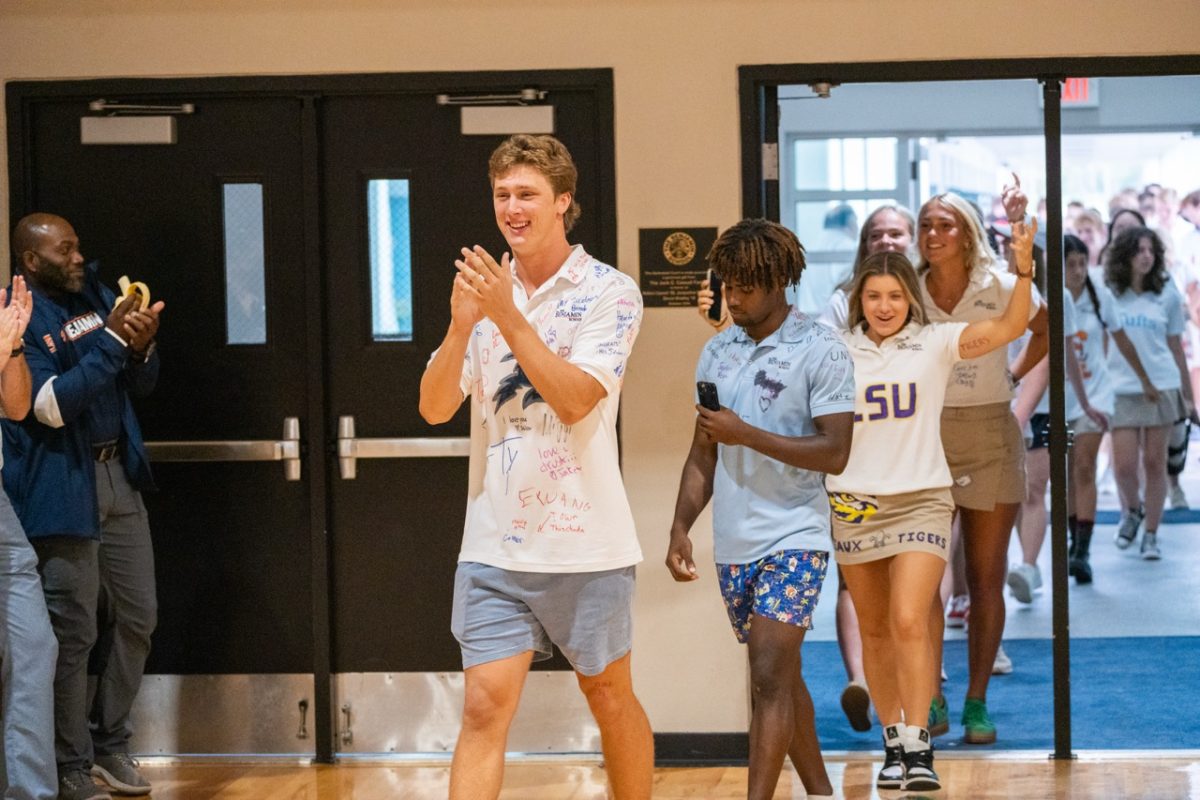 Drew Buchanan leads the Class of 2025 into the gym for their final assembly. As
is tradition, the Seniors are clapped in one last time by the Upper School community. 