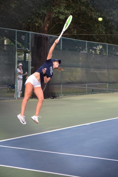 Maria Navarro serves a rocket during
the State tennis tournament.