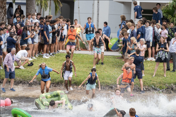 Seniors dashed from the gym to the lake, eager to splash into the murky waters and make their way across to their cheering parents.