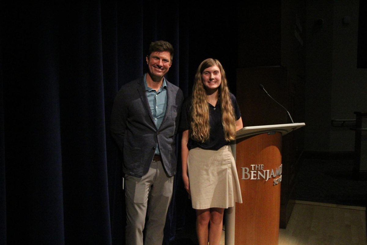 Academic Dean Mr. Andy Curtis and Senior Betsy Farmer pose for a photo after the 9/11 remembrance assembly.