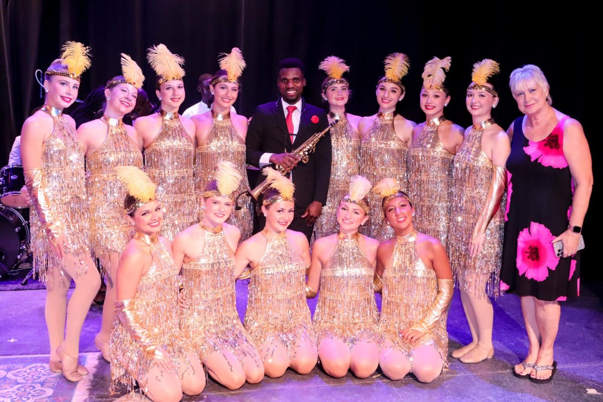 The Dazzlers pose with Mr. Abigail Milce after their performance in Lake Worth