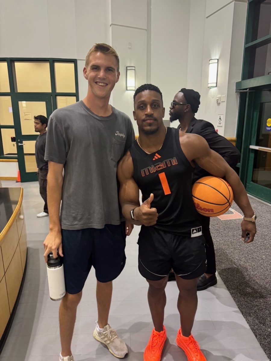 (left to right) Alumn of the Class of 2025 Calvin Poncy stands next to social media star Ashton Hall. 