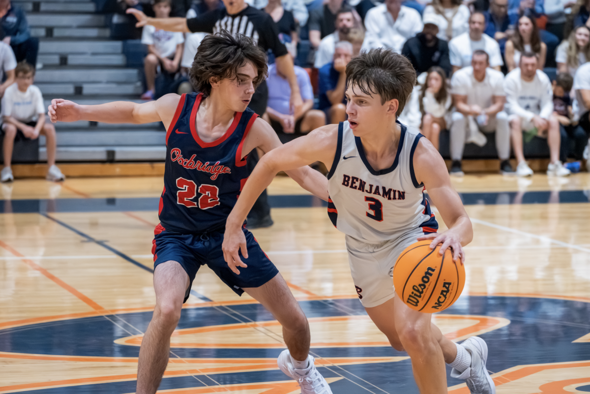 Junior and starting point guard Griffon Alterman takes the ball down the court in the first half of Benji Ball's season opener at home versus the Oxbridge Thunderwolves.