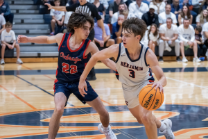 Junior and starting point guard Griffon Alterman takes the ball down the court in the first half of Benji Ball's season opener at home versus the Oxbridge Thunderwolves.
