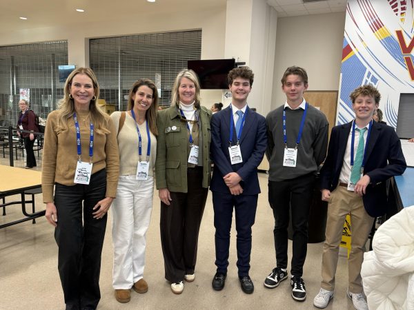 Freshman Teo Azqueta, Junior Zurich Ronert, and 8th grader Lucas Hill pose for a photo at the National Civics and Debate Championship.