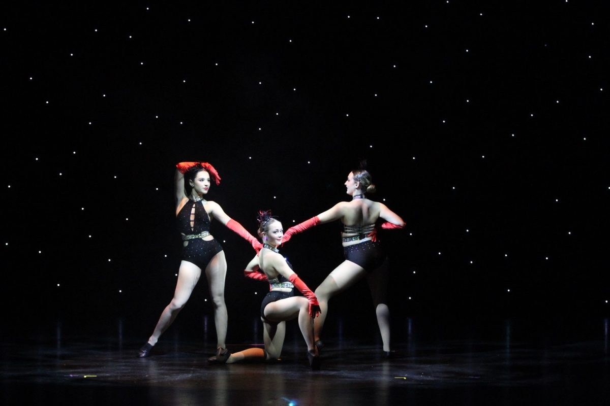 Seniors Catalina Sanchez (left), Bridget Stein (middle) and Bryce Seger (right) perform "The Best is Yet to Come."